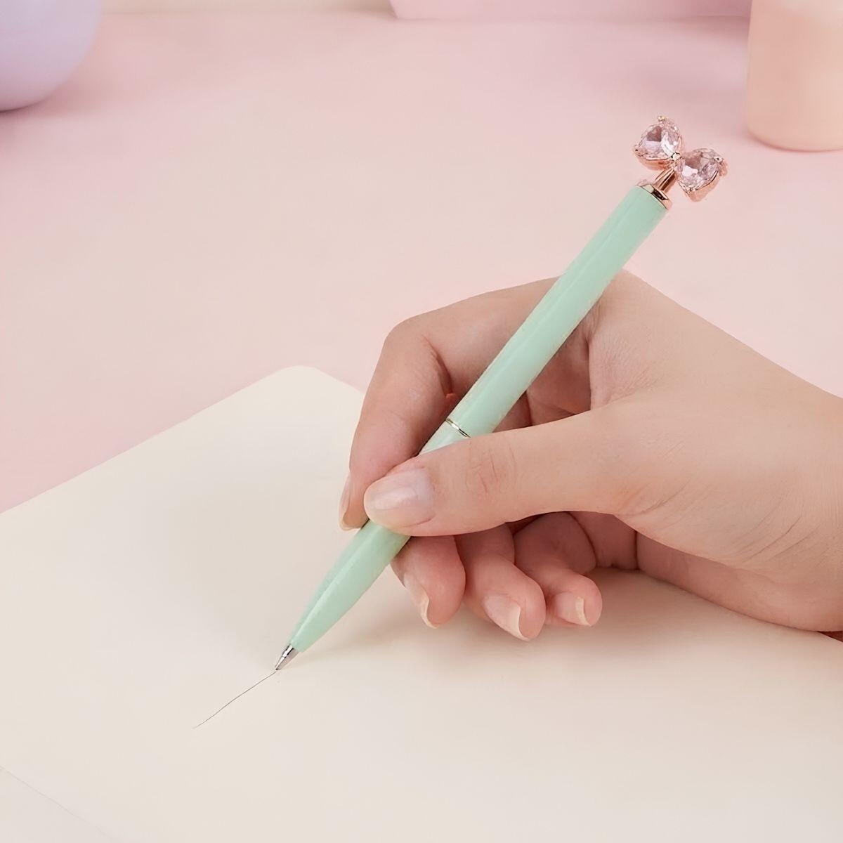 Boligrafo metal color pastel retractil c/giro y aplique lazo